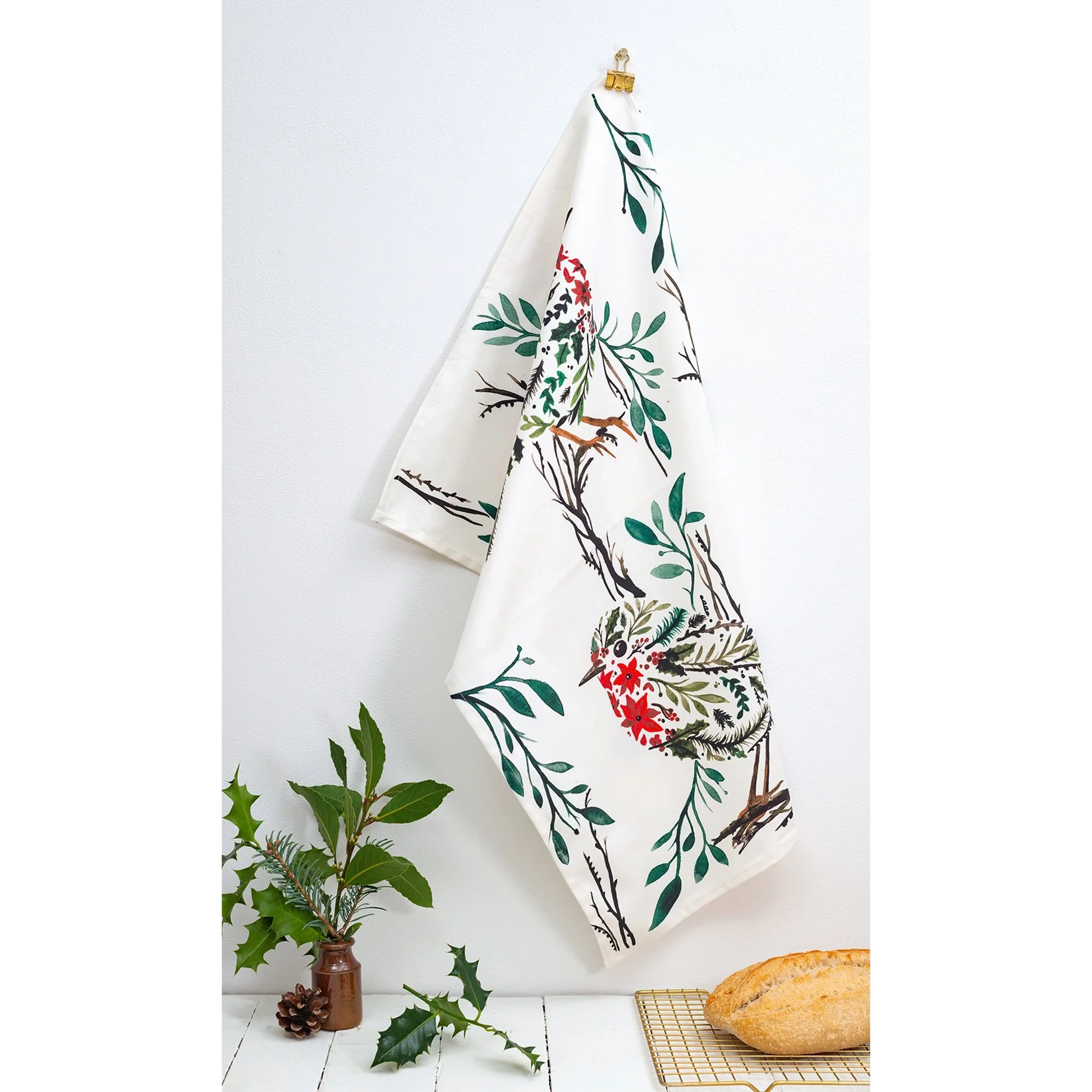 Christmas white cotton tea towel featuring a floral design with a robin