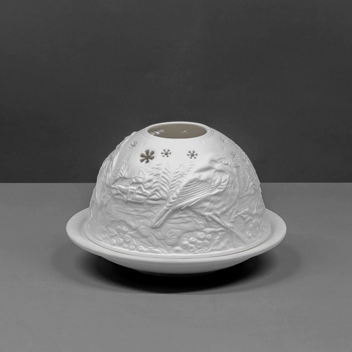 White porcelain dome candle holder with a Christmas robin design