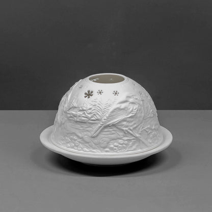 White porcelain dome candle holder with a Christmas robin design