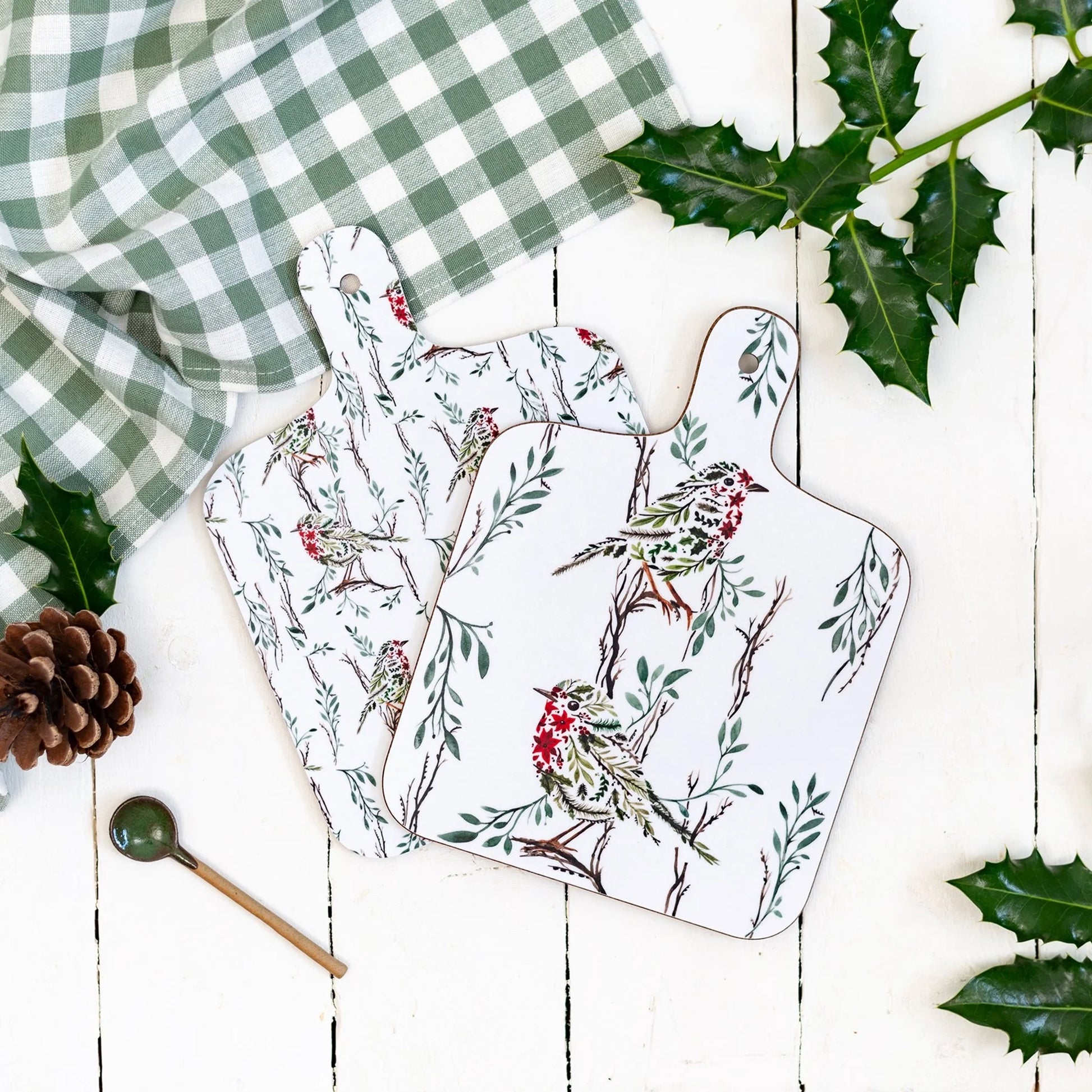 A double sided melamine chop board with a Christmas robin design