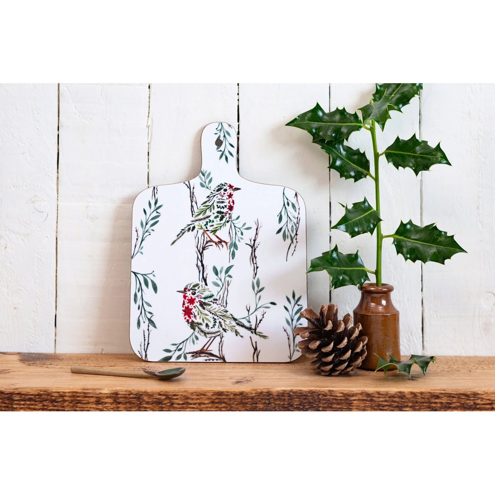 A double sided melamine chop board with the large side of the Christmas robin design