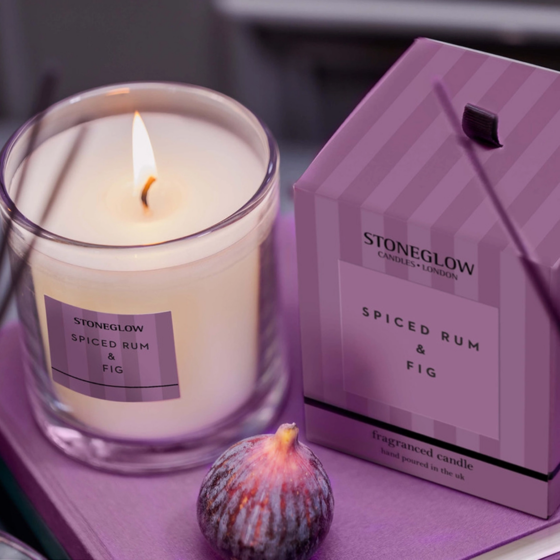 Stoneglow Spiced Rum & Fig tumbler with purple striped packaging lifestyle
