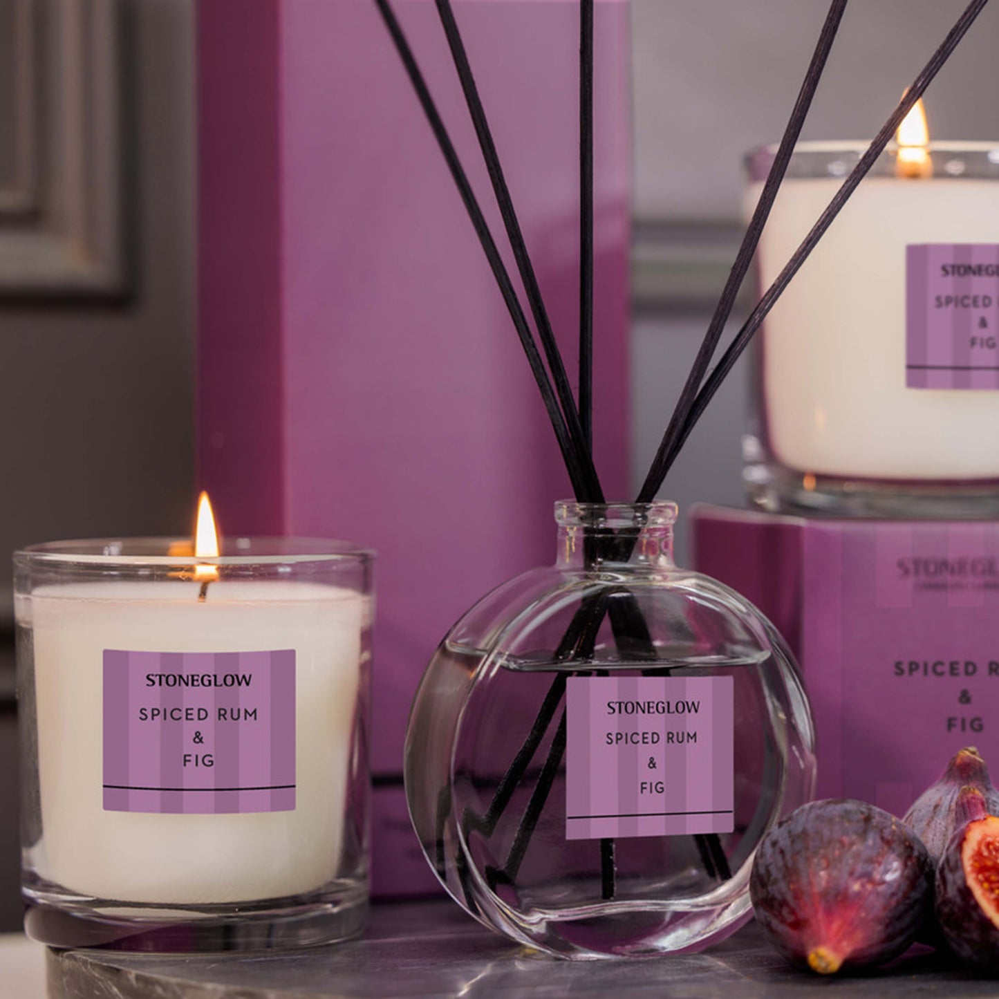 Stoneglow Spiced Rum & Fig diffuser with purple striped packaging lifestyle