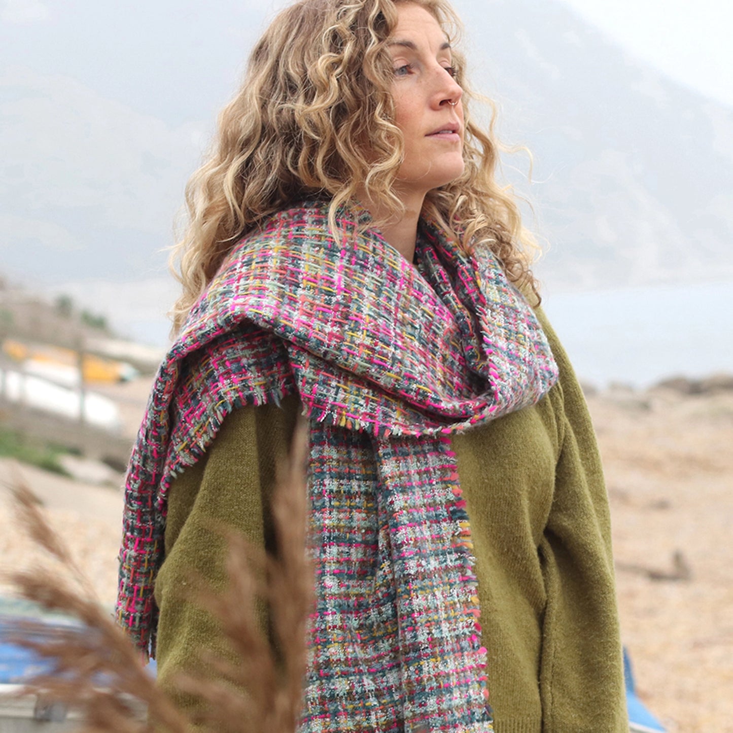 Model wearing multicolour chunky woven knit scarf