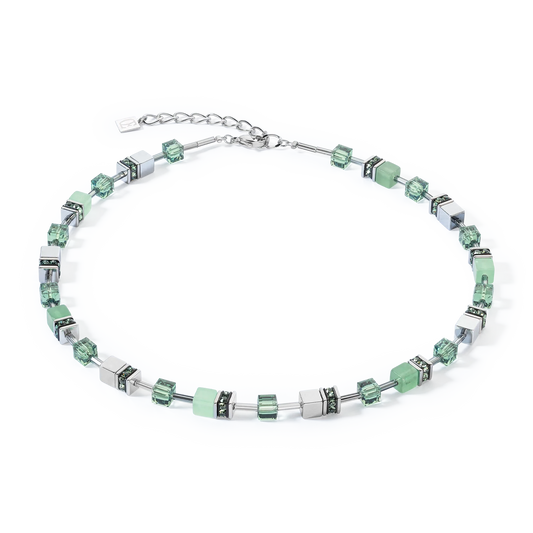 A steel necklace featuring a variety of cube shaped stones including green aventurine