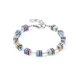 A steel bracelet featuring multicolour pastel stones