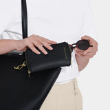 Black clip-on glasses case in faux leather with zip top with model