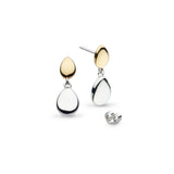 A pair of drop earrings with two pebble shapes, one in yellow gold and one in silver