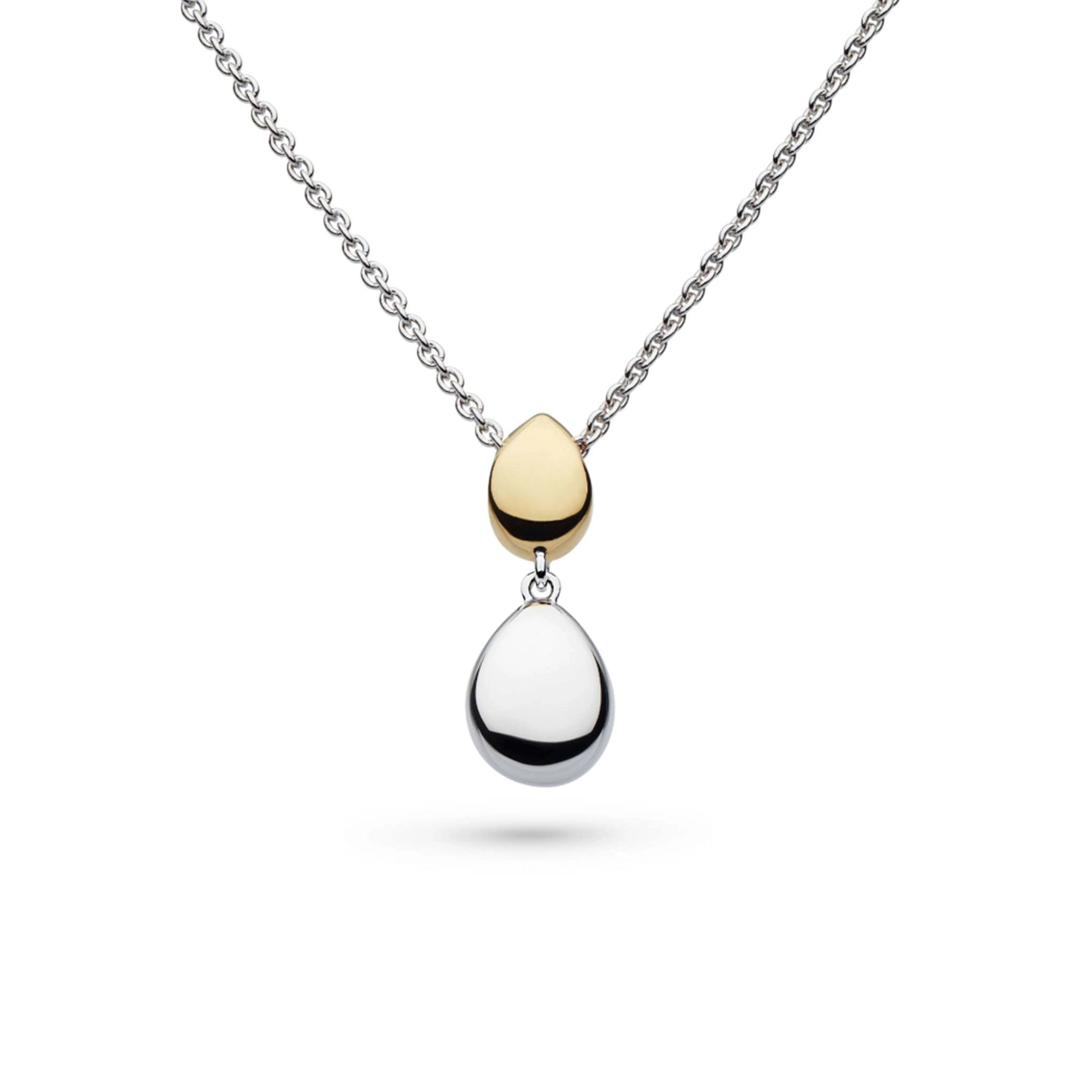 A pendant with two pebble shapes, one in yellow gold and one in silver