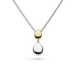 A pendant with two pebble shapes, one in yellow gold and one in silver