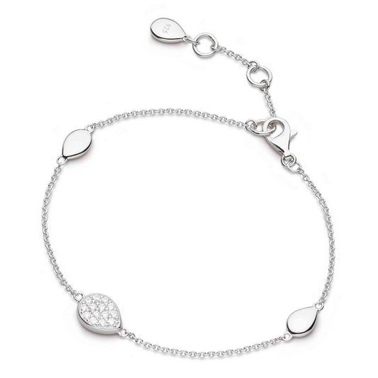 A silver bracelet with three pebble shaped pendants and one with CZ stones