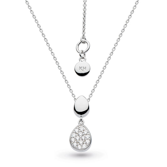 A pendant with two pebble shapes, one in pave CZ and one in silver