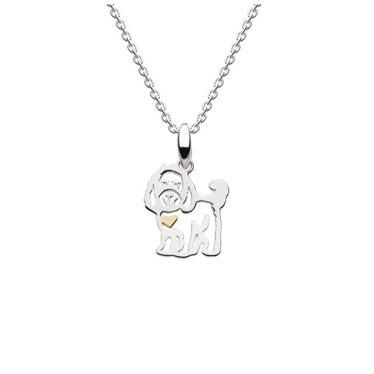 A silver pendant with a cockapoo and gold heart