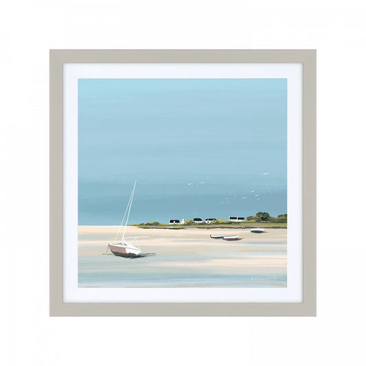 Square framed print of a low tide seaside scene with blue sky and water, moored boats and cottages on the horizon.