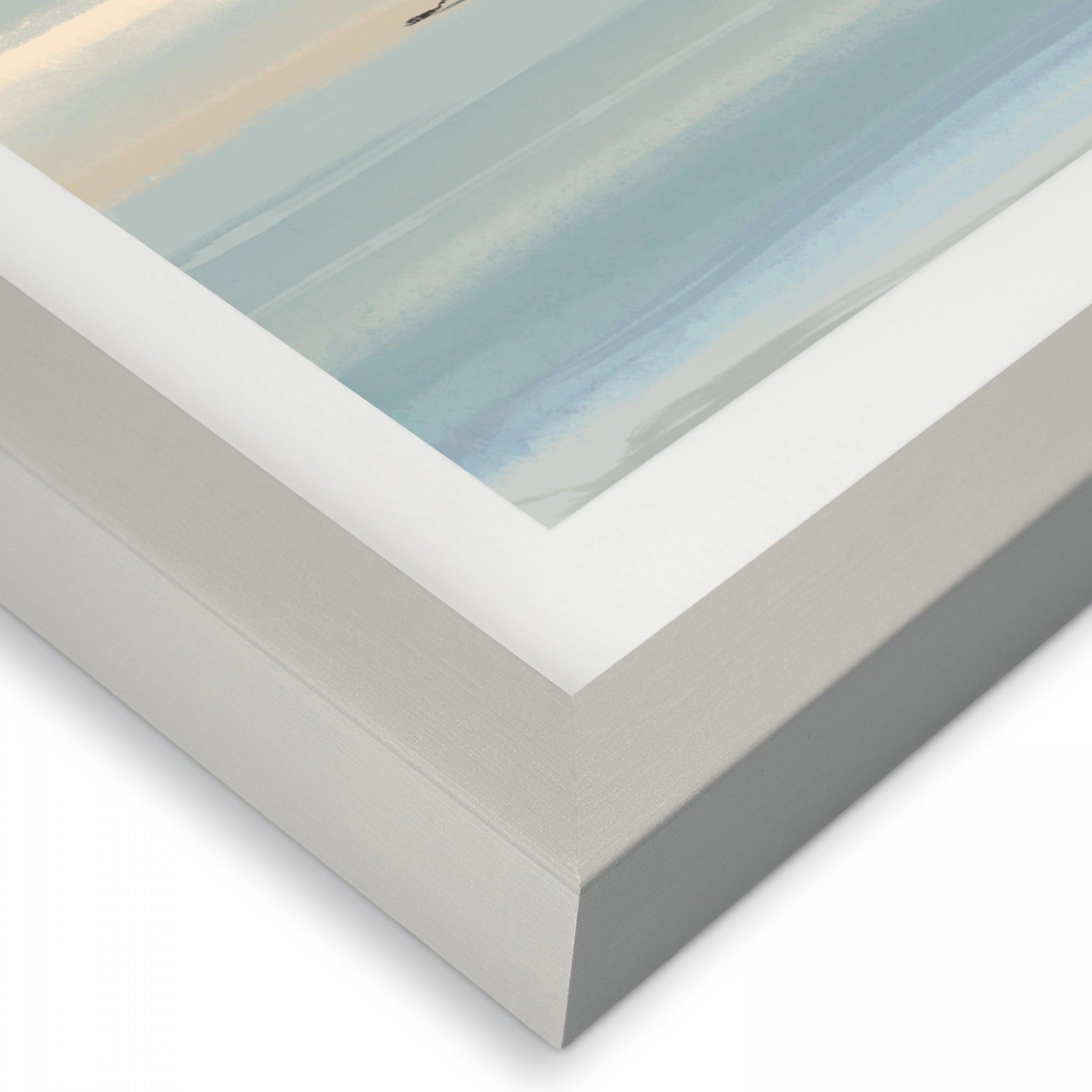 Bottom corner of a seaside print showing the simple modern grey frame.