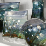 Collection of stoneware pieces, hand painted with a white cotton grass design on blue/green background