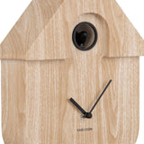 A light wood effect cuckoo wall clock detail