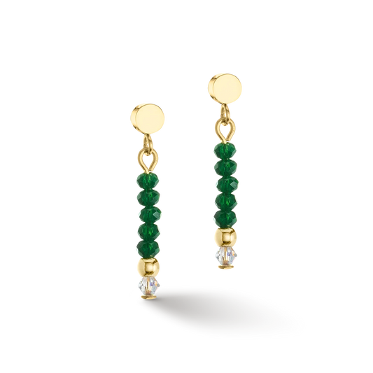 A gold pair of earrings with cut dark green glass beads