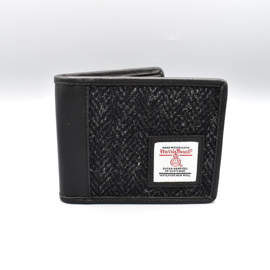 A bi-fold wallet with genuine Harris tweed fabric front in charcoal colour 