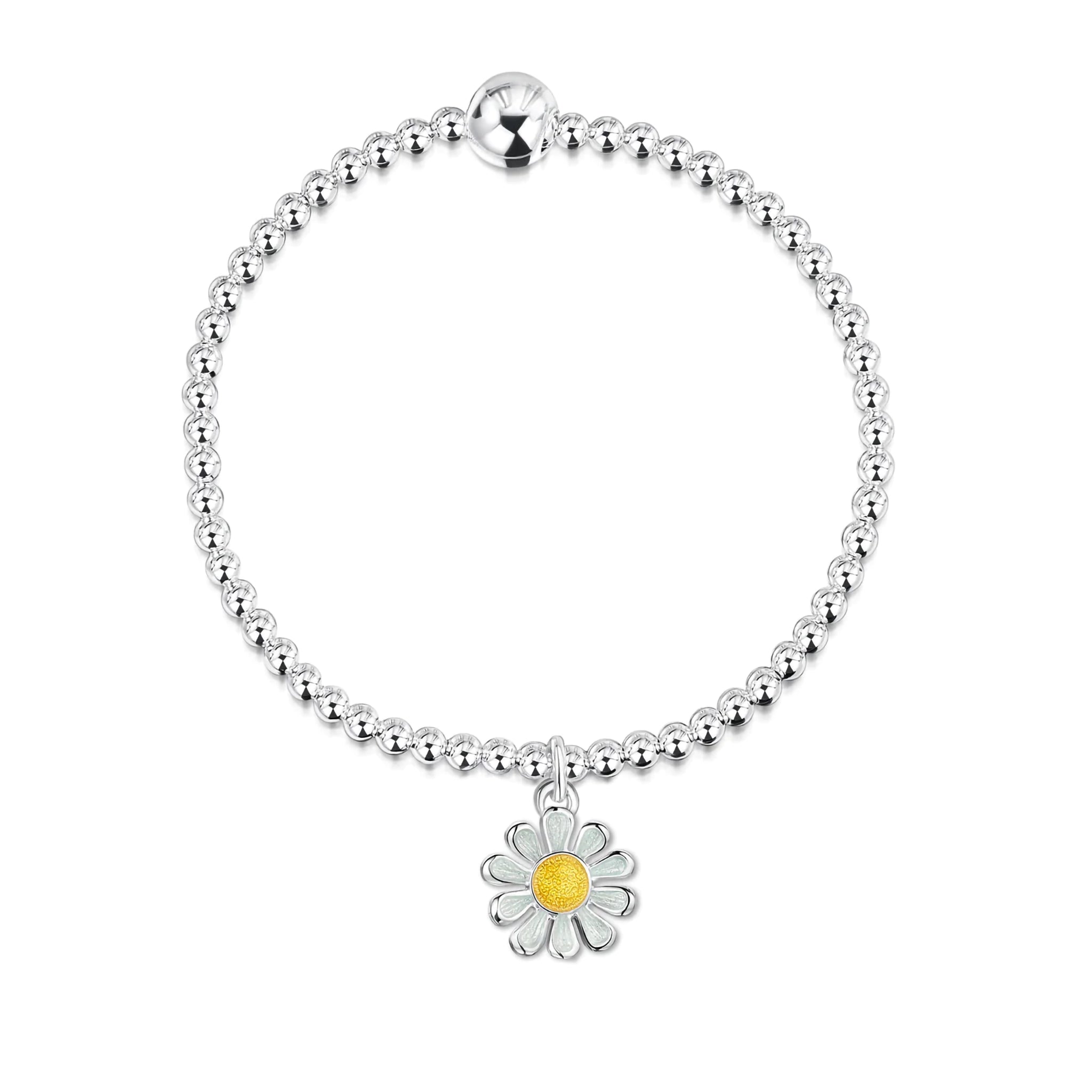 A silver beaded bracelet with a small enamelled daisy pendant