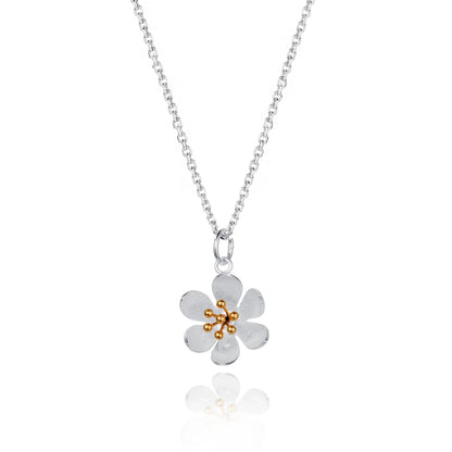 Satin finish daisy shaped necklace with gold stamen details and silver chain