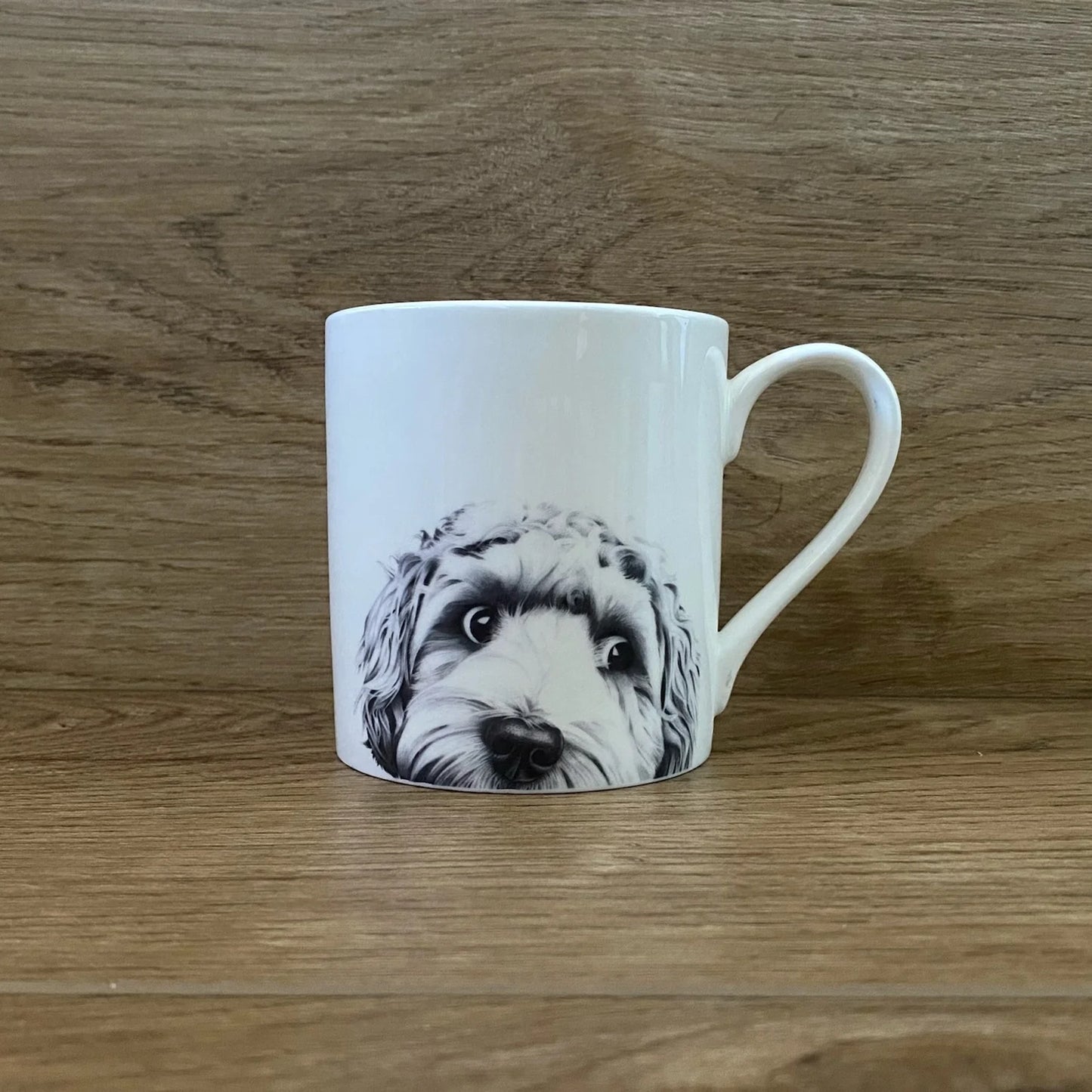 White mug with screen printed cockapoo illustration in graphite