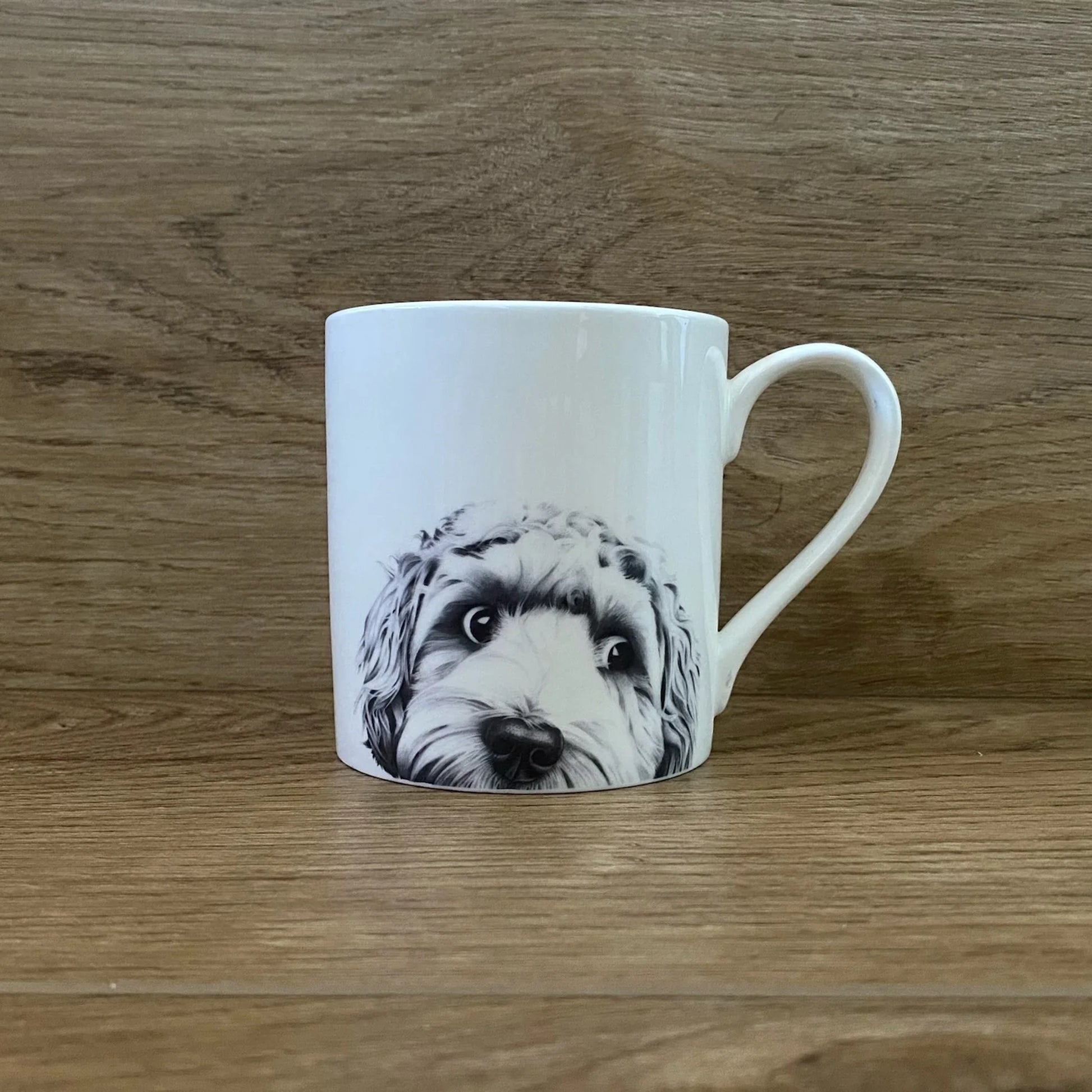 White mug with screen printed cockapoo illustration in graphite
