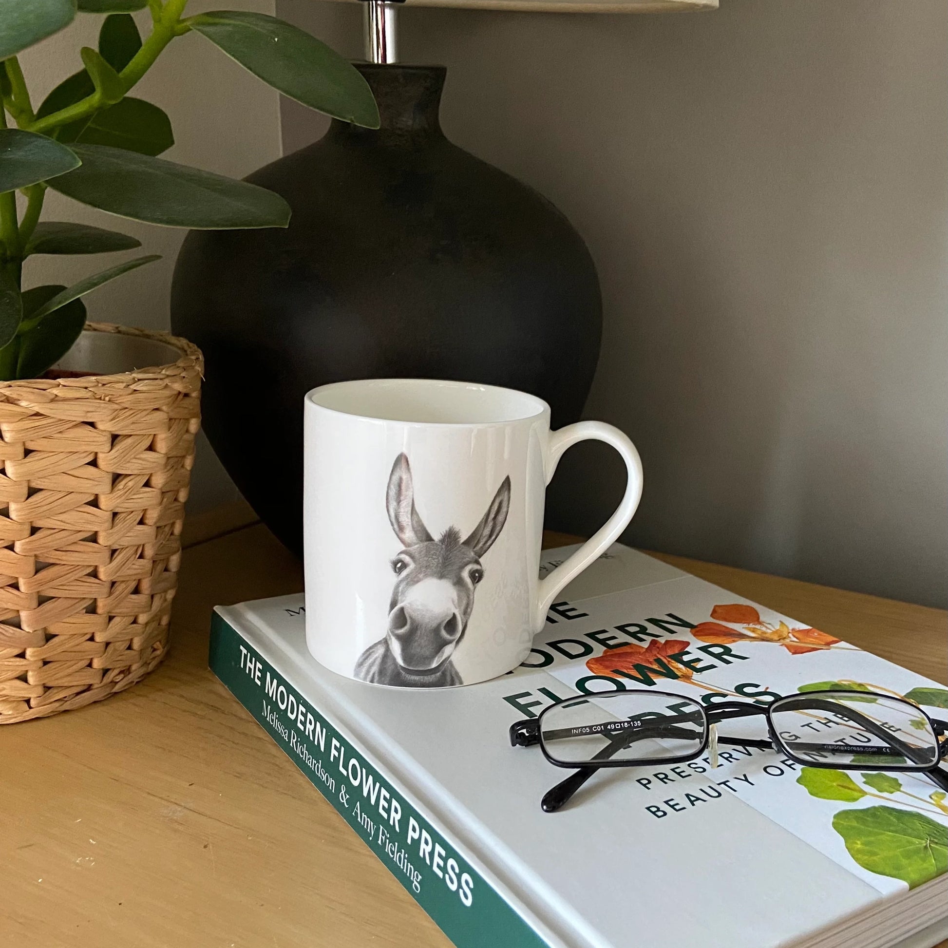 White mug with grey illustration of a donkey - lifestyle