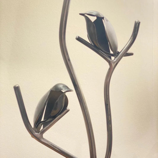 Two steel forged bird details
