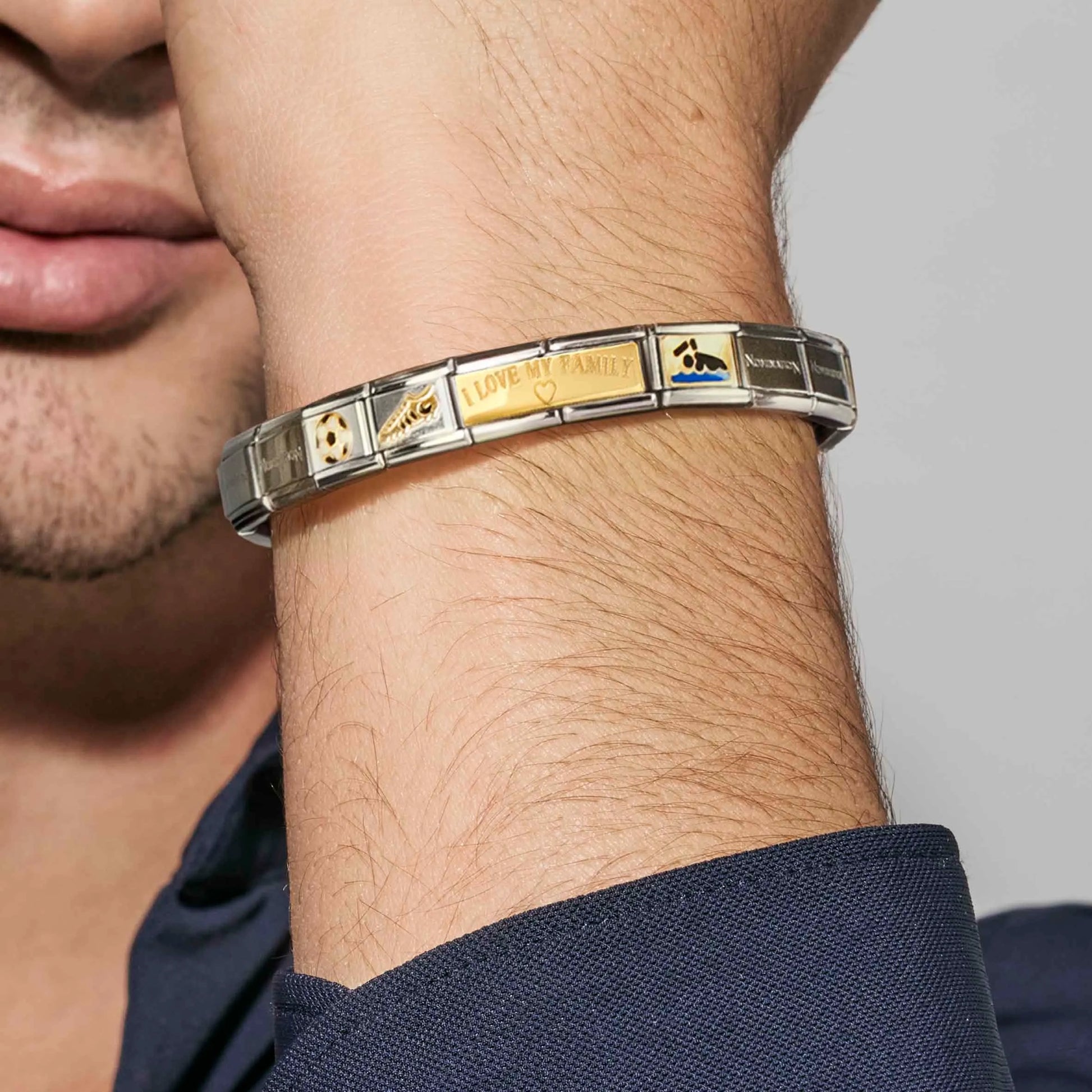 Man wearing a Nomination Italy charm bracelet with double link