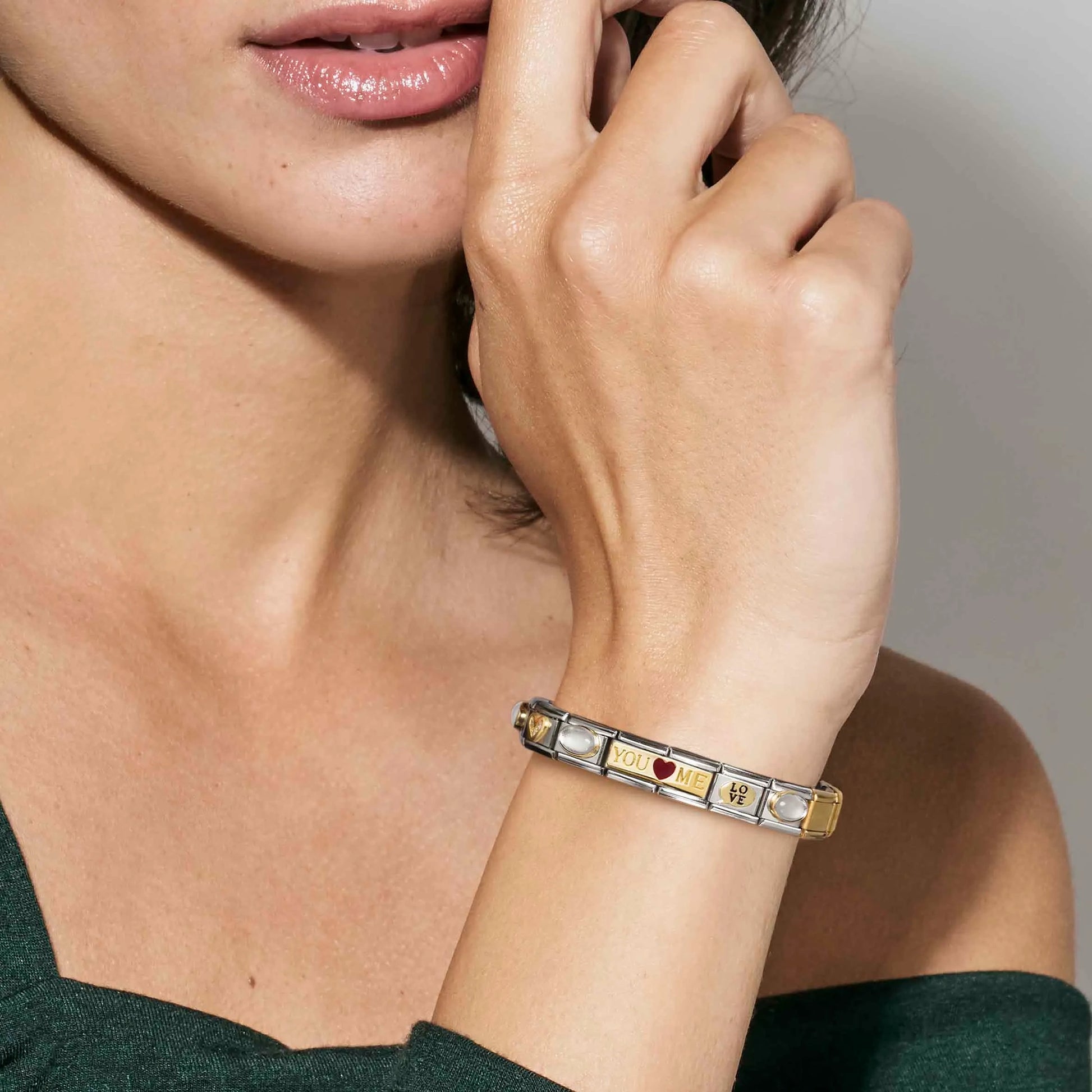 Woman wearing a Nomination Italy charm bracelet with double link