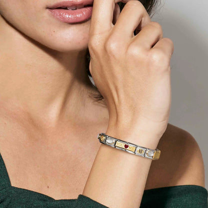 Woman wearing a Nomination Italy charm bracelet with double link