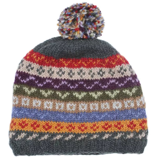 A multicolour neutral tone knitted hat with fair isle pattern and pompom