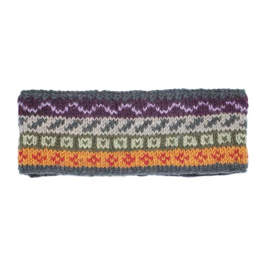 A knitted headband in earthy toned stripes and fair isle style pattern
