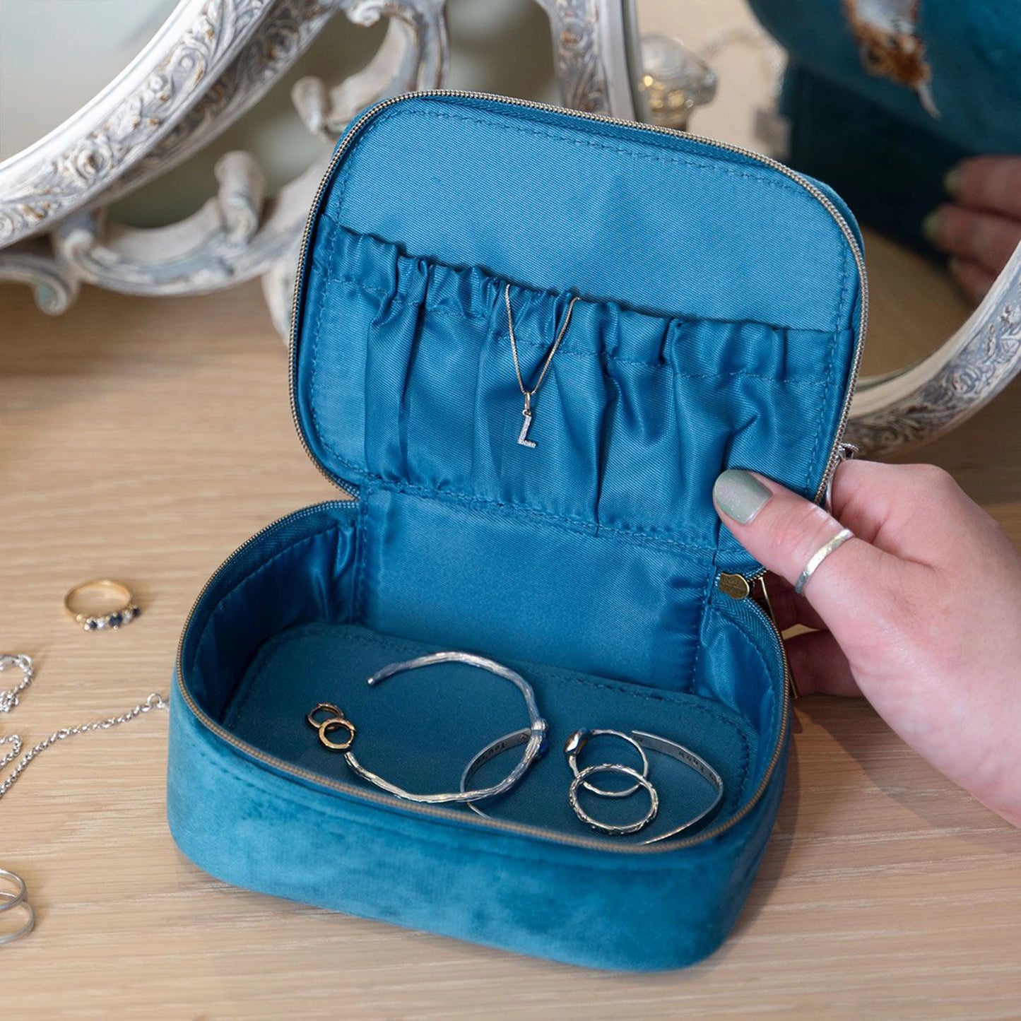 Blue faux suede zip accessory case with elastic pocket