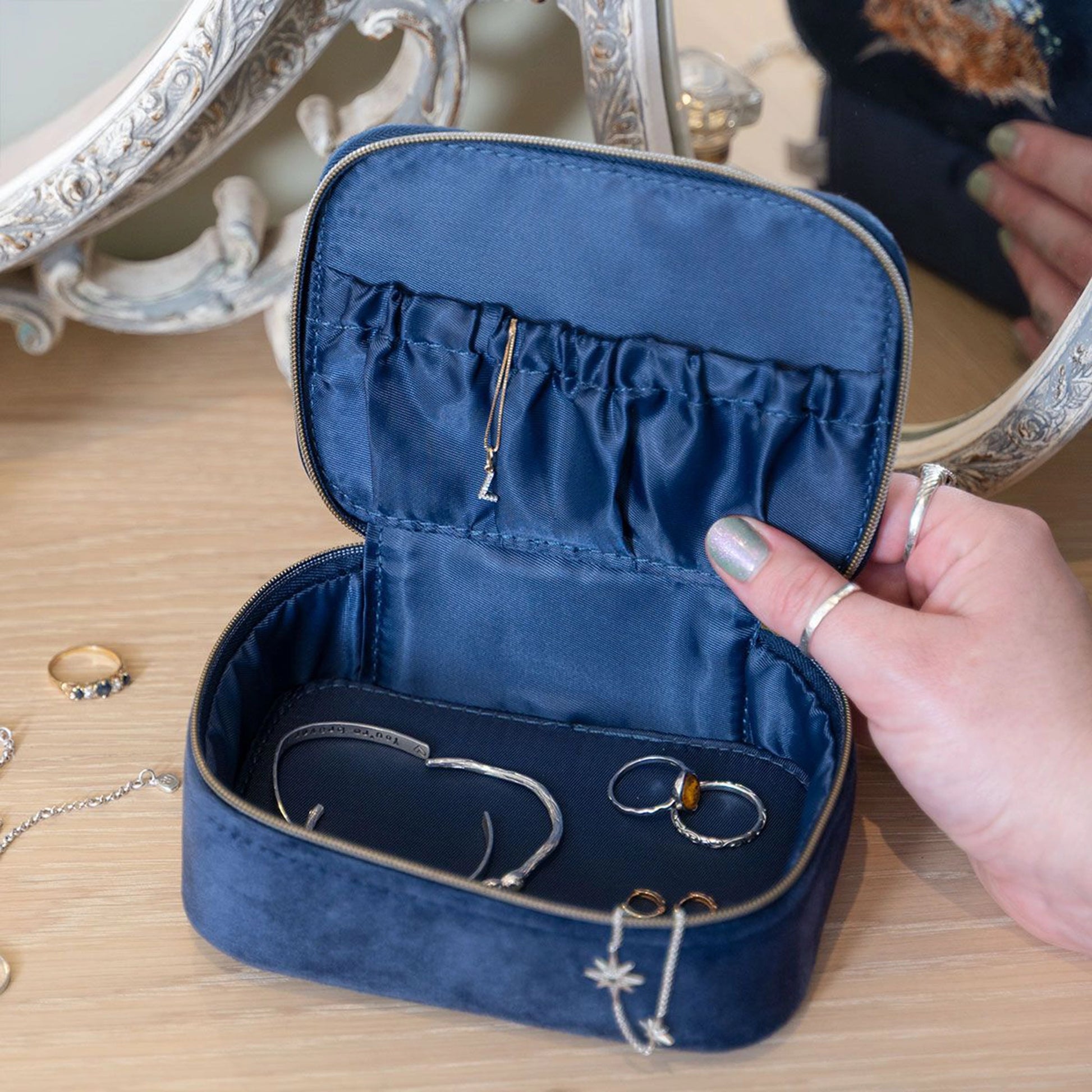 Navy blue faux suede zip accessory case with internal elasticated pocket