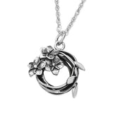 Round vine wreath shaped pendant with 3 flower design on a silver chain