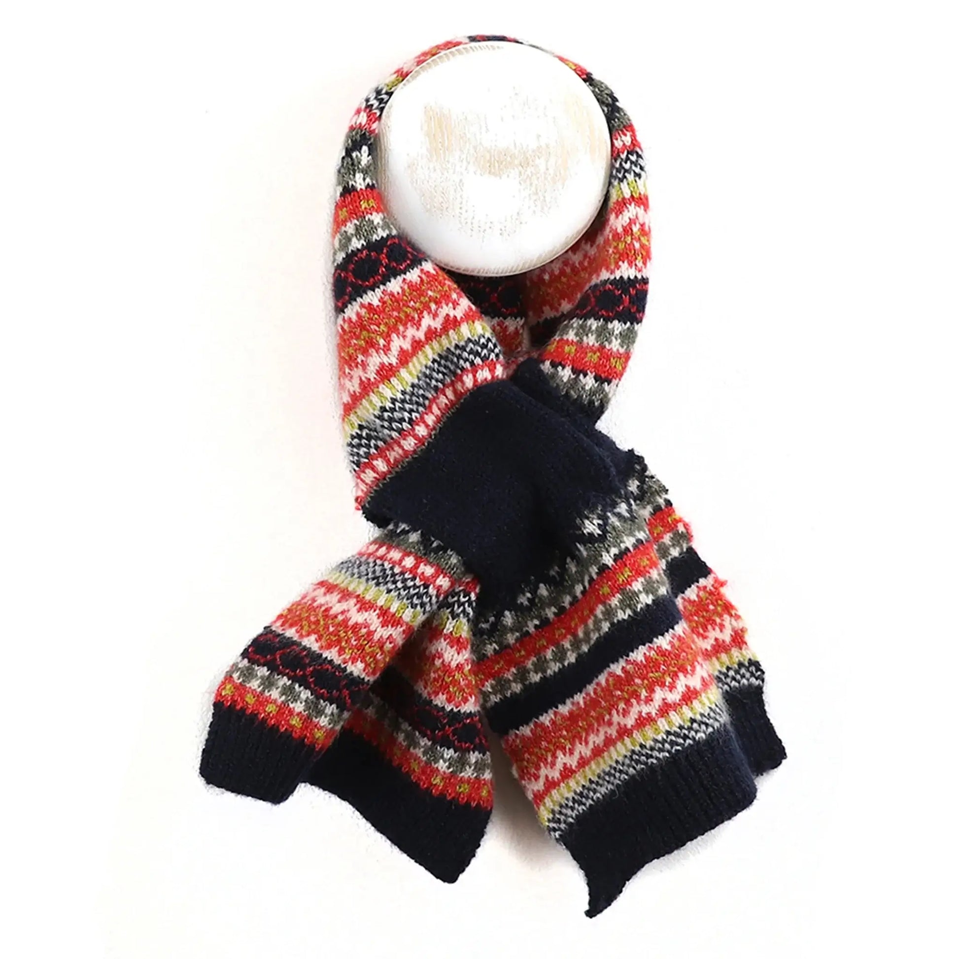 Fair Isle patterned knitted pull through scarf in navy blue and rust colours