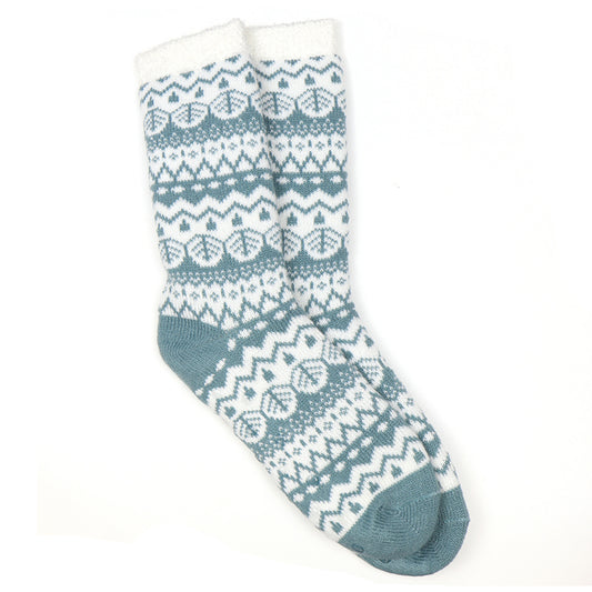 A pair of knitted slipper socks with a white and duck egg blue fair isle pattern