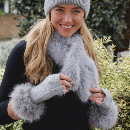 Faux fur pull-through scarf in a grey colour on model