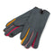 A pair of grey faux suede gloves with colourful blocks between the fingers in red, pink and yellow