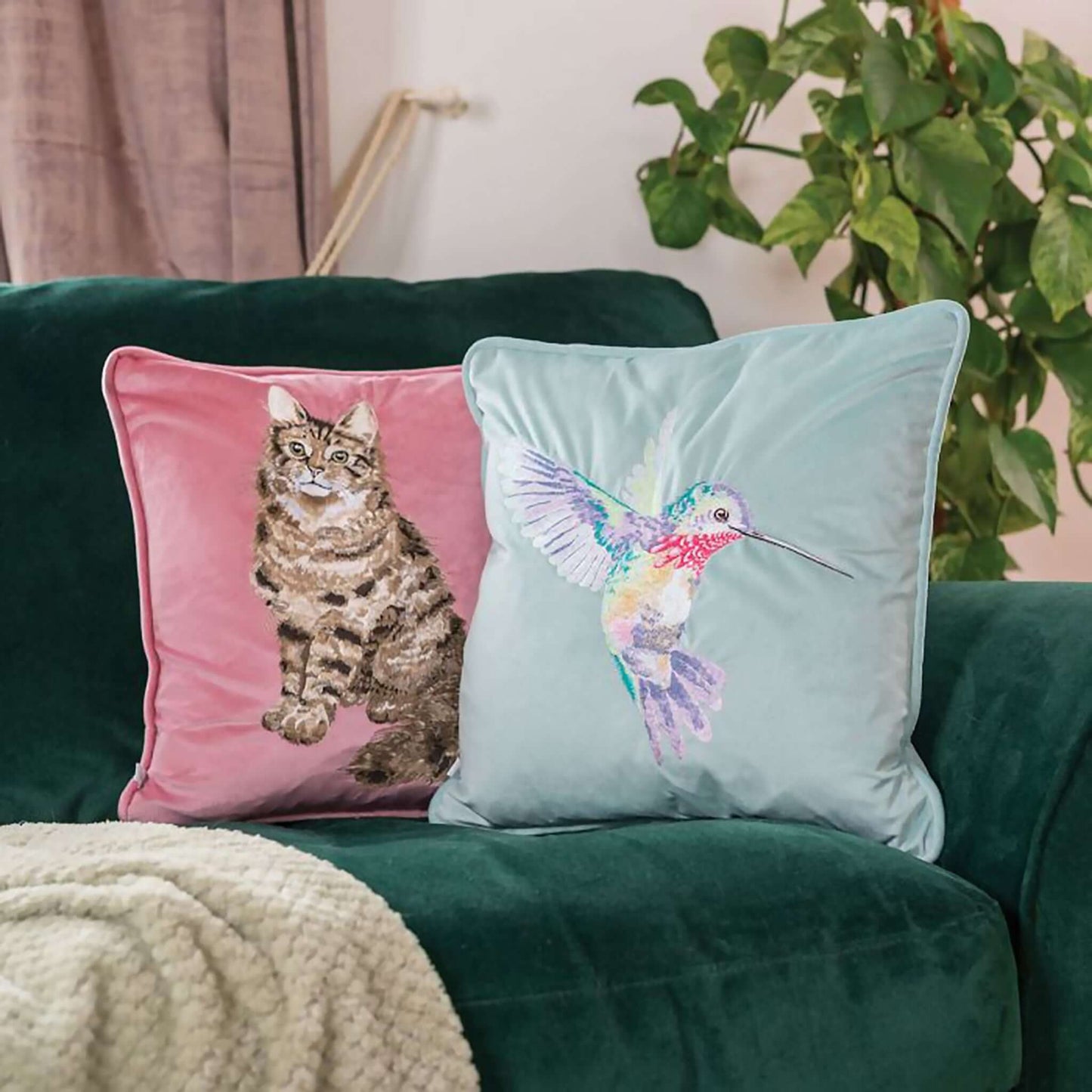 Pink faux suede cushion with embroidered tabby cat design lifestyle