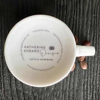 Katherine Sheard logo on the base of a white espresso mug