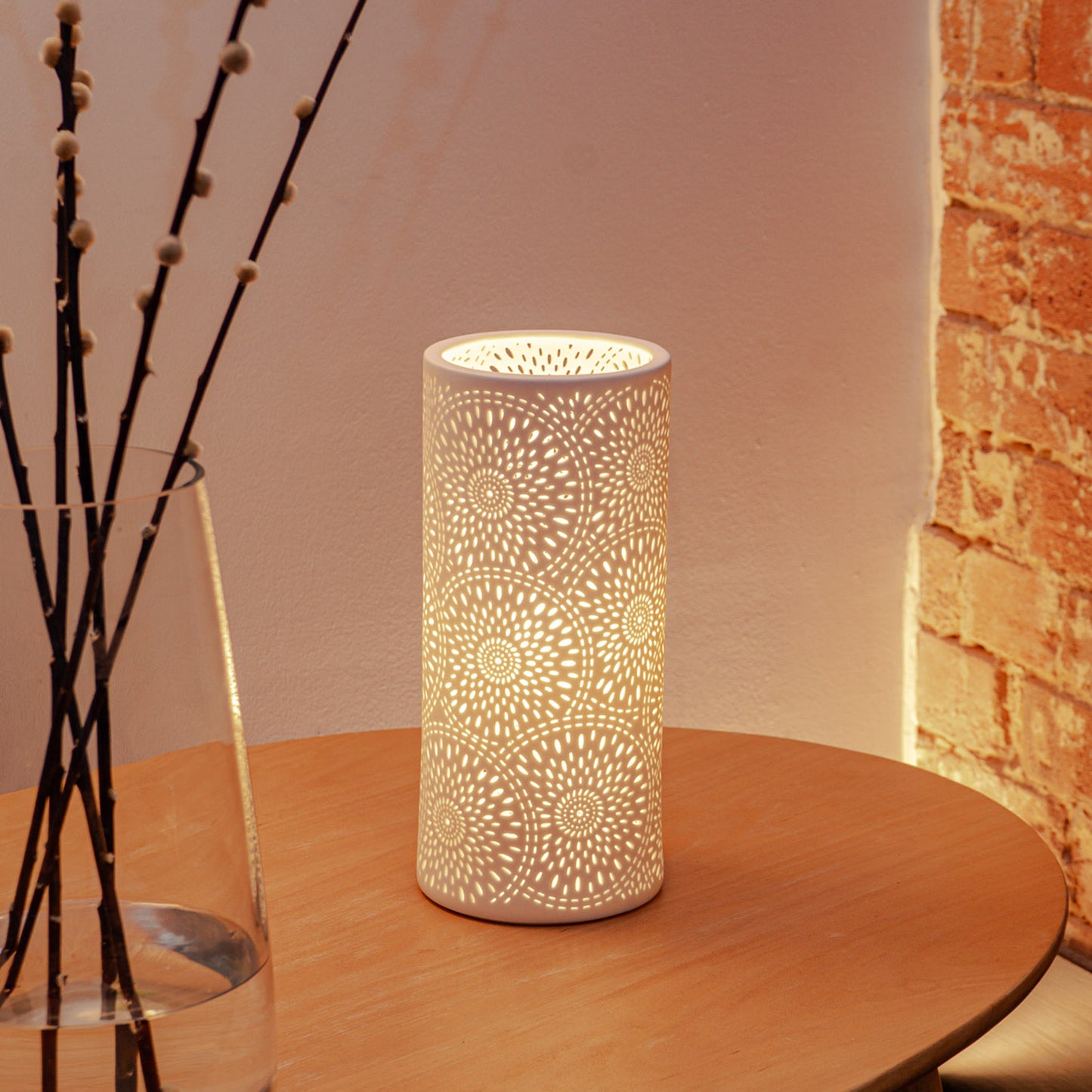 White porcelain column lamp with perforated firework design lifestyle