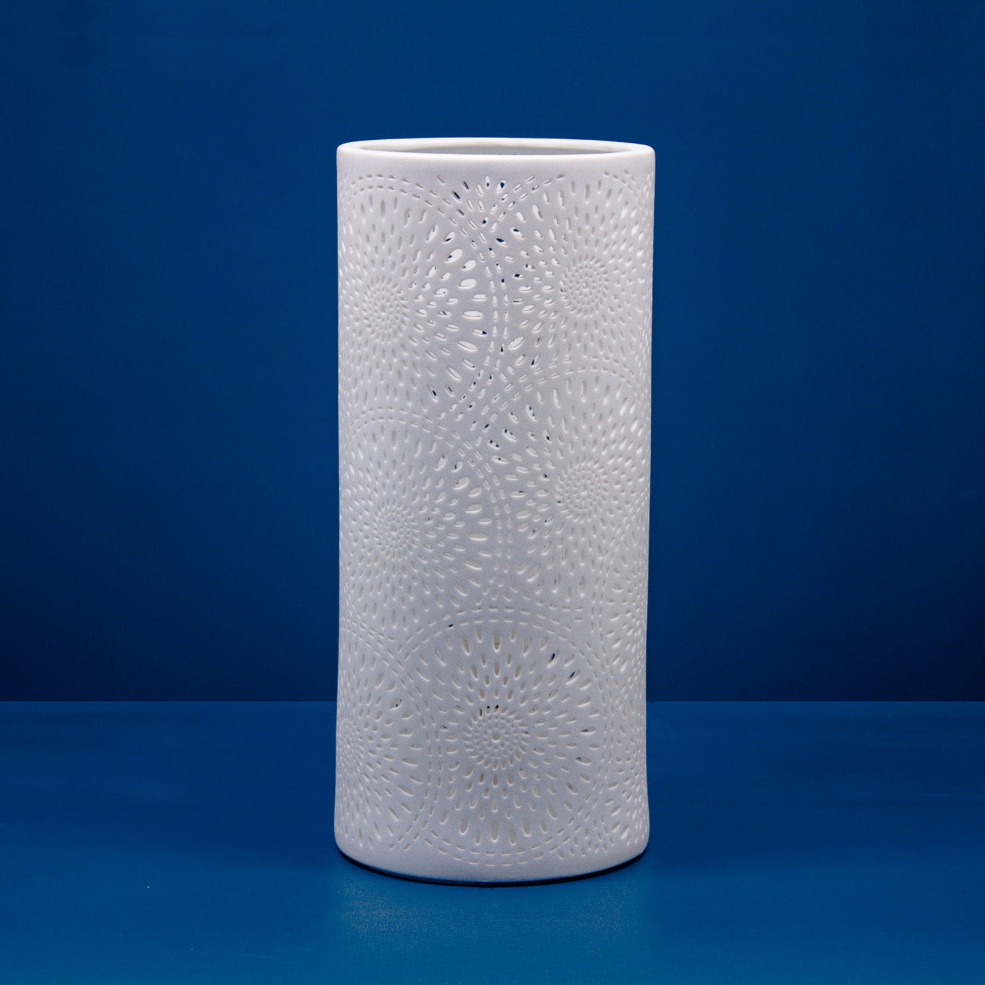 White porcelain column lamp with perforated firework design off