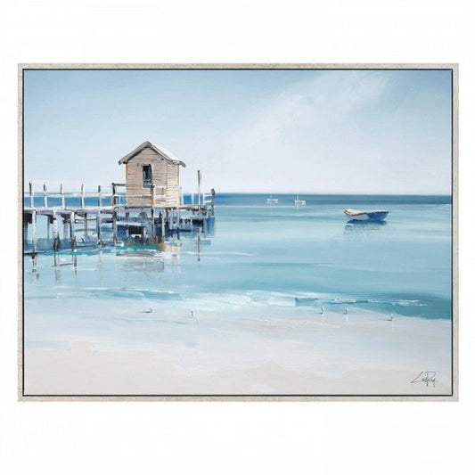 Framed canvas print with a wooden pier at the seaside and white boats in the distance.