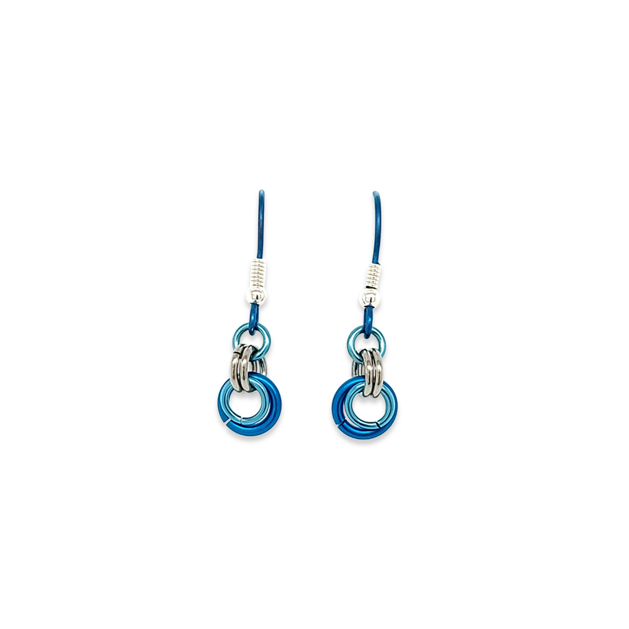 A pair of titanium drop earrings with 5 linked hoops in different shades of blue