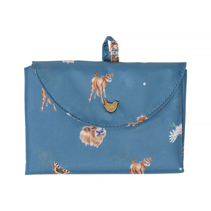 Folded blue shopping tote bag with Highland Cow pattern
