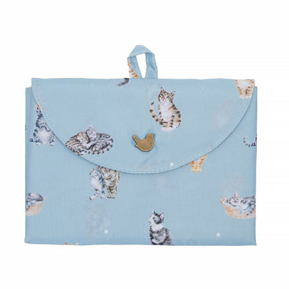 Folded blue shopping tote bag with repeat cat design