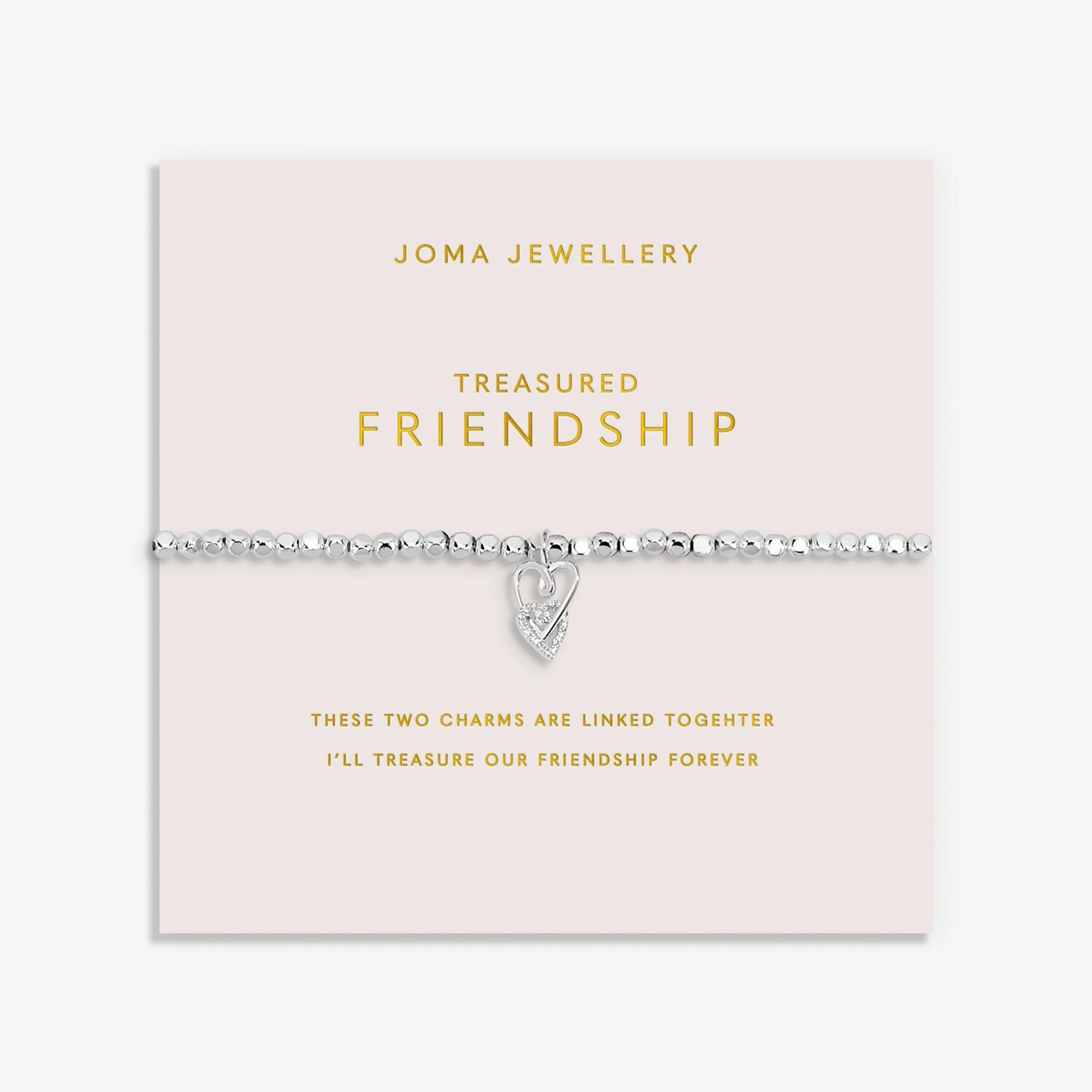 Silver bracelet with two interlinked hearts in silver and CZ, with a sentiment that reads 'Treasured Friendship'